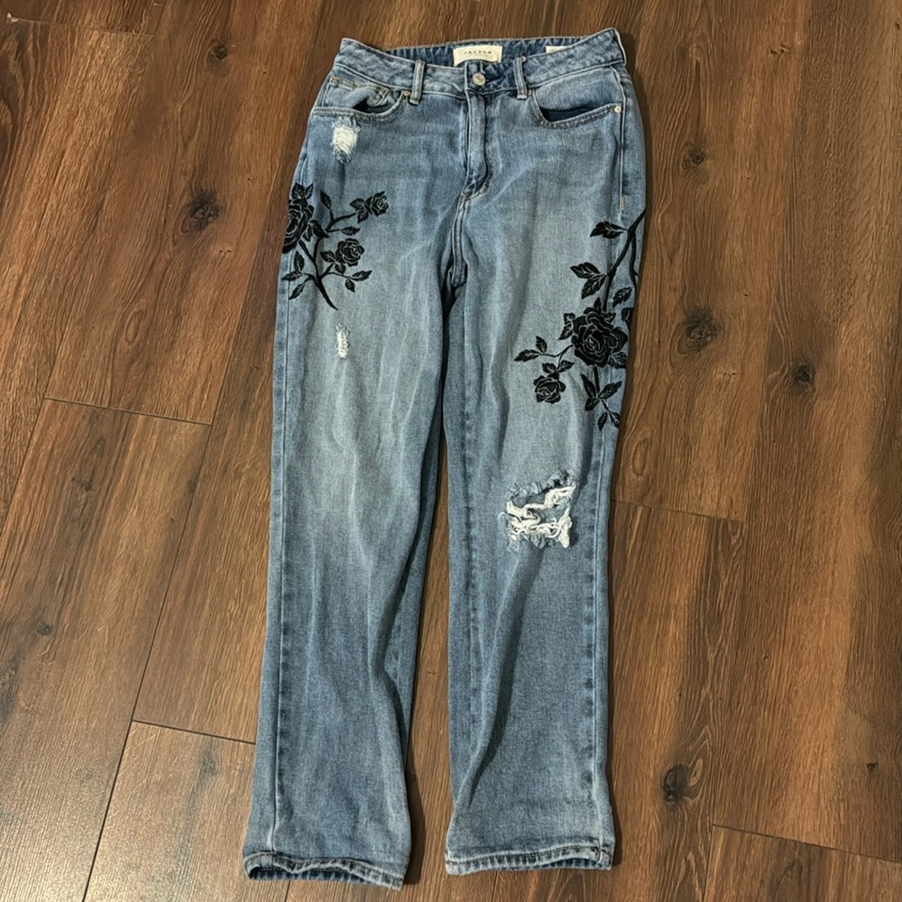 Floral medium wash jeans with holes